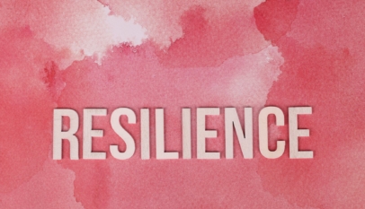 the word resilience on pink surface