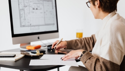 crop estate agent working with computer in office