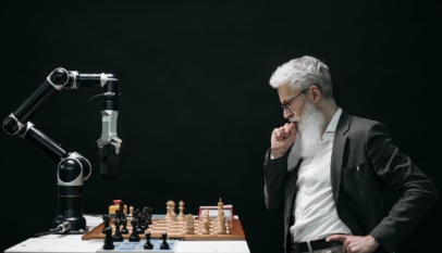 elderly man thinking while looking at a chessboard