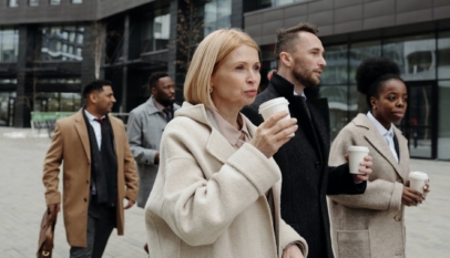 coworkers taking a coffee break and walking