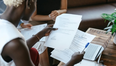 black woman reading information of important document